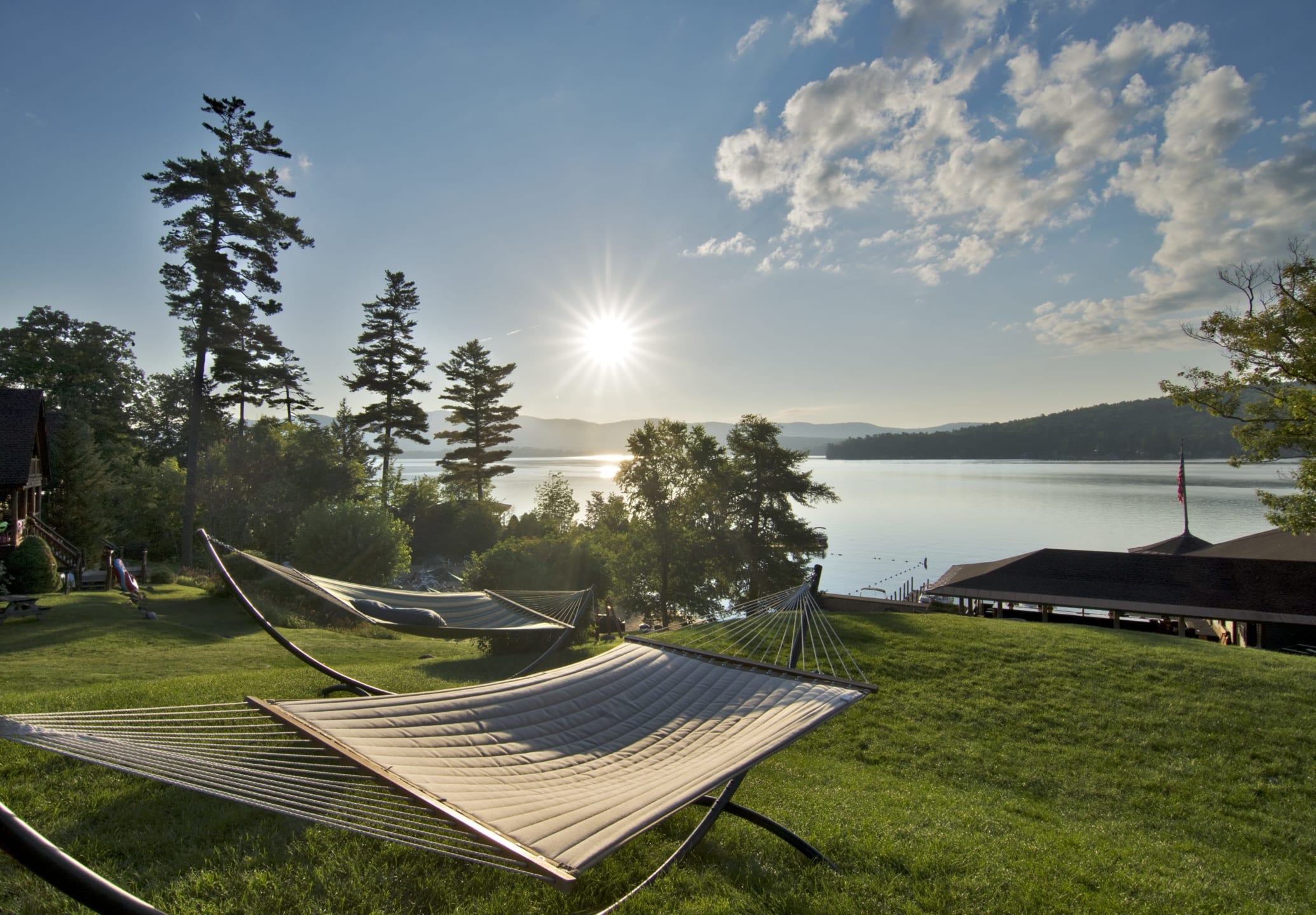 lakeside-hammocks Hammocks setup near lake.