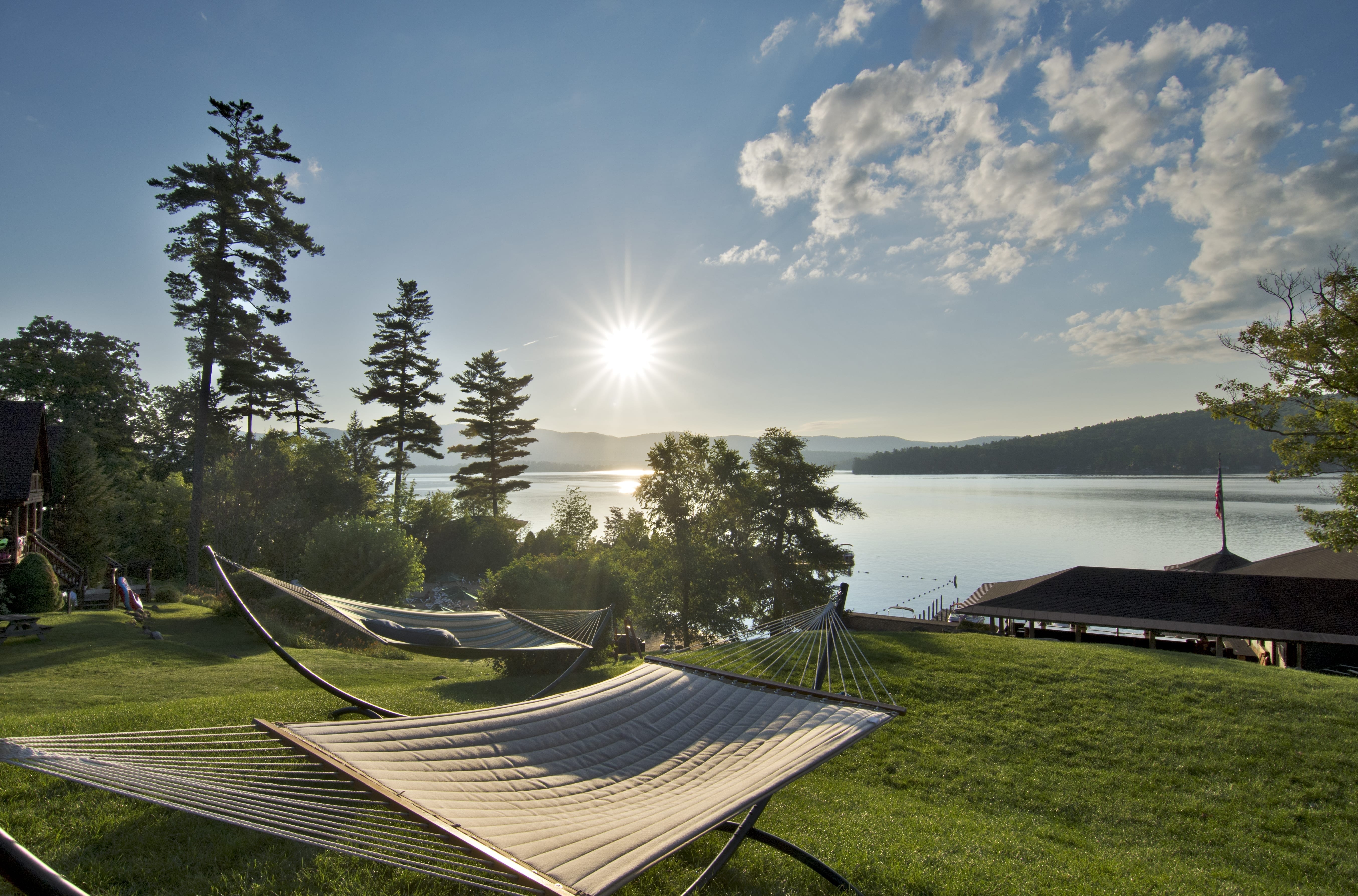 Hammocks setup near lake.