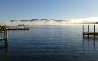 View of low clouds over lake in summer.