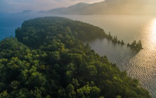 Aerial view of Lake George and surrounding mountains.