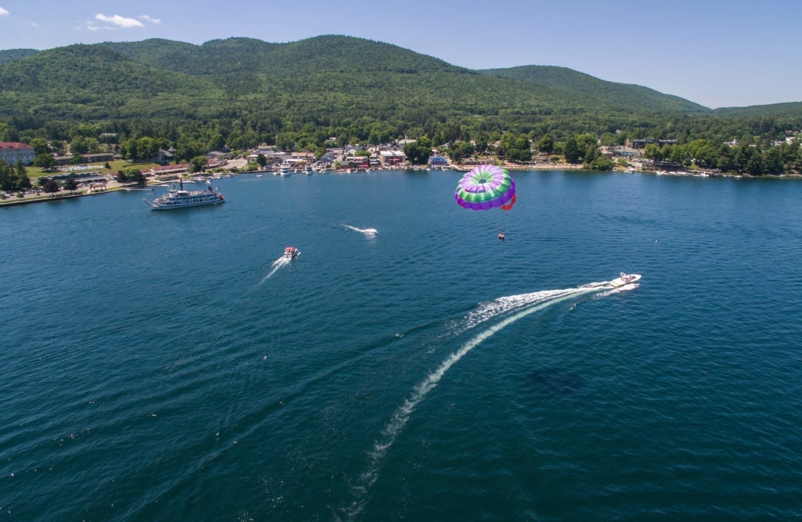 Para-glider over Lake George near town.