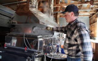 Man making maple syrup