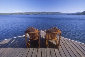 A pair of Adirondack chairs overlooking pristine Lake George.