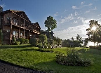 A stunning wide angle shot of the Lodges at Cresthaven during an Adirondacks summer.