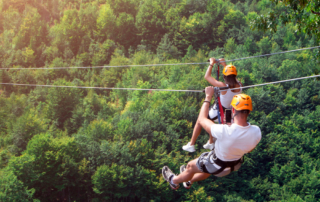 Photo of person ziplining: one of the best Things to Do in the Adirondacks