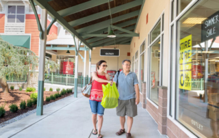 Photo of two people exploring the Lake George shopping scene