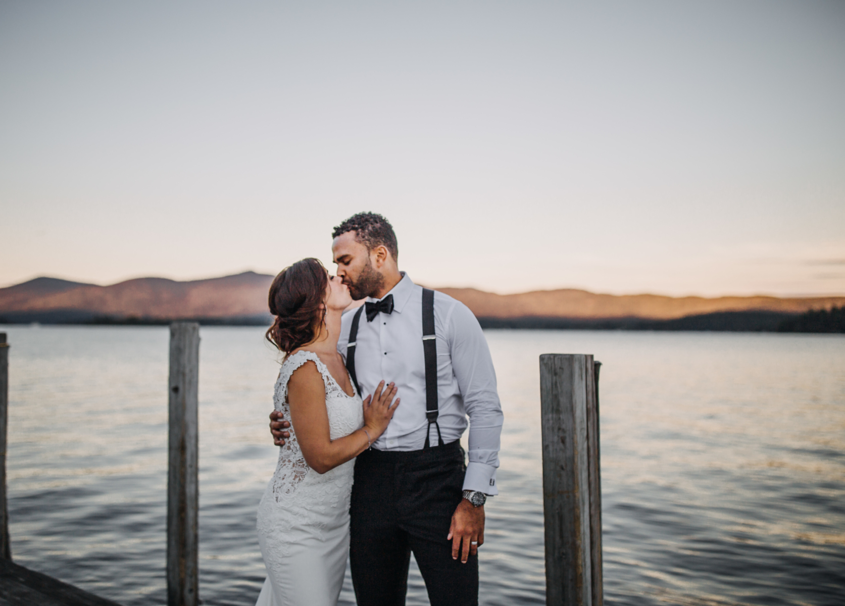 Bride and Groom kissing on pier