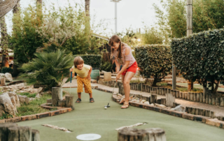 Photo of kids playing mini golf in Lake George