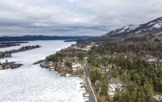 Aerial view of Lake George in the winter, a great time to enjoy indoor activities in Lake George