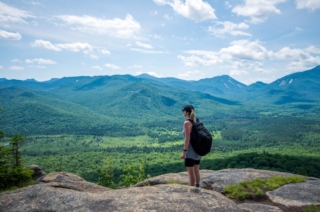 Person hiking in the mountains at Lake George parks