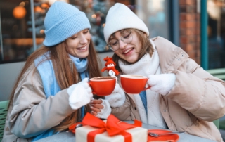 Two girls drinking coffee at a shop in Lake George, NY